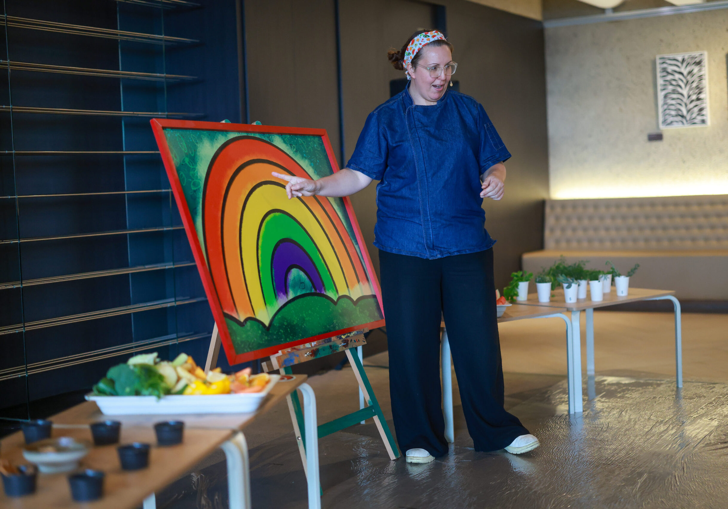 Chef Luisa Scrimshaw demonstrating a cooking technique to students during a school incursion