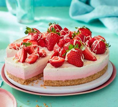 Triple-layered berry cheesecake served on a plate